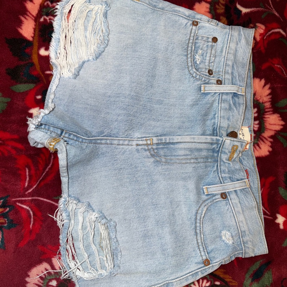 Alice + Olivia Light Wash Ripped Denim Shorts